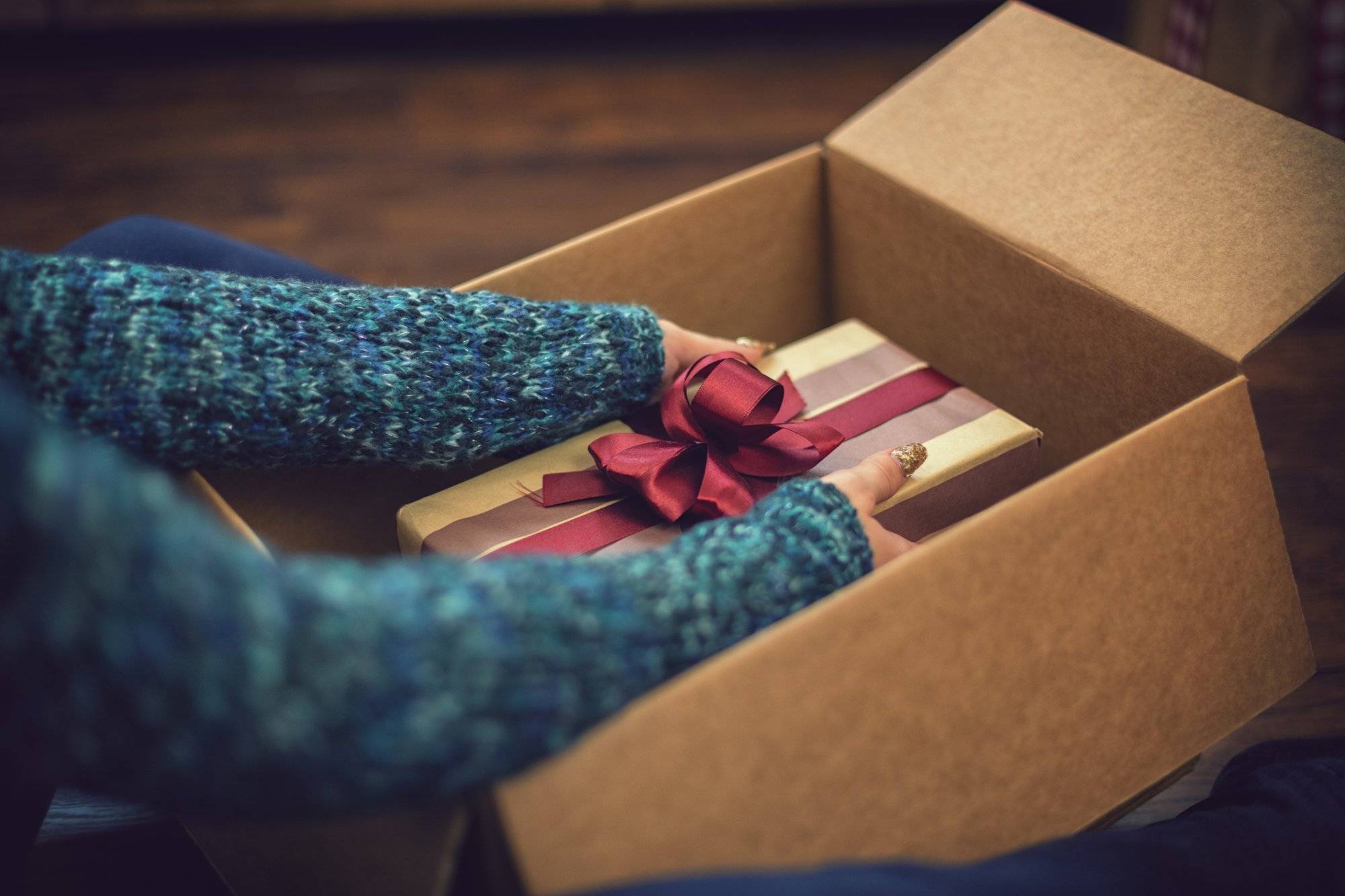 Young girl getting parcel on Christmas Young girl getting parcel on Christmas